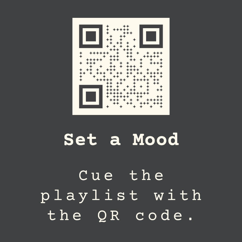 QR code on a dark background with text 'Set a Mood' and 'Cue the playlist with the QR code.'